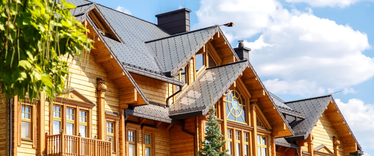 New custom-built log home in Wisconsin with detailed wood architecture