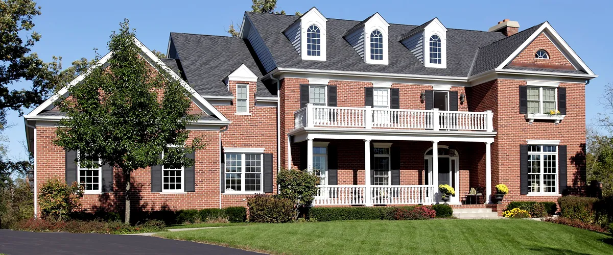 New custom-built brick home in Wisconsin with a large driveway