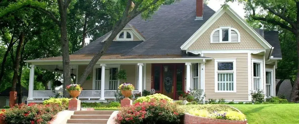 Charming custom home with front porch and landscaped garden